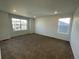 Large bedroom with carpeted floor and sizable windows at 191 Freemont Ct, Brighton, CO 80601