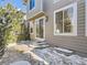 Stone patio, partially covered in snow, adjacent to home at 10767 Mountshire Cir, Highlands Ranch, CO 80126