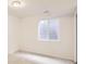 Spacious finished basement bedroom with neutral carpeting and large window at 10767 Mountshire Cir, Highlands Ranch, CO 80126