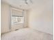 Well-lit bedroom with ceiling fan and window at 10767 Mountshire Cir, Highlands Ranch, CO 80126