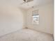 Bright bedroom with window and ceiling fan at 10767 Mountshire Cir, Highlands Ranch, CO 80126