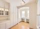 Kitchen with white cabinets, island, and breakfast nook at 10767 Mountshire Cir, Highlands Ranch, CO 80126