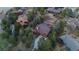 Aerial shot of a home with mature trees and outdoor living space at 8140 Lightening View Dr, Parker, CO 80134
