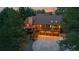 Overhead view of a charming home with lush surroundings and a spacious driveway with three-car garage at 8140 Lightening View Dr, Parker, CO 80134