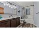 Updated bathroom with a stylish vanity, modern fixtures, and a shower with a glass block window at 8140 Lightening View Dr, Parker, CO 80134