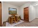 This cozy breakfast nook features a vintage rug, seating for four, and a decorative painting at 8140 Lightening View Dr, Parker, CO 80134