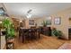 Spacious dining room boasting hardwood floors, modern lighting, and elegant furnishing; ideal for entertaining at 8140 Lightening View Dr, Parker, CO 80134