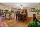 Dining room featuring hardwood floors, modern lighting, and views to living area for open, connected living at 8140 Lightening View Dr, Parker, CO 80134