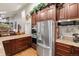 Elegant kitchen showcasing stainless steel appliances, granite countertops, and custom cabinetry for modern cooking at 8140 Lightening View Dr, Parker, CO 80134