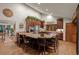 Bright eat-in kitchen with granite countertops, wood cabinets, stainless steel appliances, and decorative finishes at 8140 Lightening View Dr, Parker, CO 80134