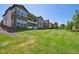 Expansive backyard with green grass and a view of neighboring houses at 12121 Bryant St, Westminster, CO 80234