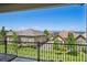 View from the porch showcasing manicured lawns, neighborhood homes, and mountain views at 12121 Bryant St, Westminster, CO 80234