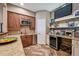 This bar features wooden cabinets, granite countertops, a small sink, and a mini fridge at 12121 Bryant St, Westminster, CO 80234