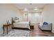 Bright bedroom featuring recessed lighting, wood floors, and a sitting area at 12121 Bryant St, Westminster, CO 80234