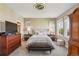 Spacious primary bedroom with accent lighting, multiple windows, and a ceiling fan at 12121 Bryant St, Westminster, CO 80234