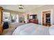 Large primary bedroom with exterior access, ensuite bath, and walk-in closet at 12121 Bryant St, Westminster, CO 80234
