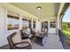 Relaxing covered patio featuring comfortable wicker seating and views of the backyard at 12121 Bryant St, Westminster, CO 80234