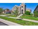 A well-maintained lawn and landscaped walkway lead to the front door of this charming home at 12121 Bryant St, Westminster, CO 80234