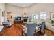 Bright living room with high ceilings, hardwood floors, and a cozy fireplace at 12121 Bryant St, Westminster, CO 80234