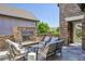 Inviting outdoor patio features a stone fireplace and comfortable seating area at 12121 Bryant St, Westminster, CO 80234
