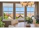 Mountain views from dining room with large windows at 12121 Bryant St, Westminster, CO 80234