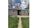 A walkway path leads from the main house to a two-car garage at 7620 Kearney Dr, Commerce City, CO 80022