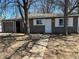 Charming single-story home with a detached garage, a well-maintained facade, and a welcoming walkway at 7620 Kearney Dr, Commerce City, CO 80022