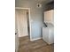 Practical laundry area featuring stackable washer/dryer and neutral walls at 7620 Kearney Dr, Commerce City, CO 80022