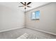 Cozy bedroom featuring plush carpet, a ceiling fan, and a window with natural light at 9465 Yampa St, Commerce City, CO 80022