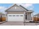 Charming single-Gathering home features a two-car garage, neutral paint, and well-maintained landscaping at 9465 Yampa St, Commerce City, CO 80022
