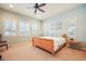 Main bedroom with plush carpeting and ceiling fan at 26674 E Phillips Pl, Aurora, CO 80016