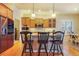 Kitchen with island, stainless steel appliances, and wood cabinets at 26674 E Phillips Pl, Aurora, CO 80016