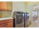 Convenient laundry room with washer, dryer, and utility sink at 26674 E Phillips Pl, Aurora, CO 80016