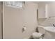 Basement bathroom with clean fixtures including sink, toilet, and shower at 2634 S Humboldt St, Denver, CO 80210