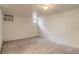Finished basement space with neutral carpeting and paint, offering versatility for various uses at 2634 S Humboldt St, Denver, CO 80210
