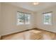 Bright, empty bedroom with hardwood floors and abundant natural light at 2634 S Humboldt St, Denver, CO 80210