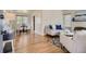 Open-concept living room with hardwood floors, a dining area, and modern furnishings at 2634 S Humboldt St, Denver, CO 80210