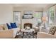 Bright living room with stylish furniture, hardwood floors, and a decorative fireplace at 2634 S Humboldt St, Denver, CO 80210