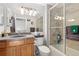 Bathroom featuring a tiled shower and tub combo with a light granite vanity top at 1606 S Flanders Way, Aurora, CO 80017