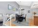 Elegant dining room with hardwood floors, gray walls, and stylish decor, offering a perfect space for entertaining guests at 1606 S Flanders Way, Aurora, CO 80017