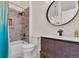 Bathroom with tub, shower, vanity, round mirror, and stylish decor at 8747 Mesquite Row, Lone Tree, CO 80124