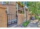 Charming home exterior with gated entrance and well-maintained landscaping at 8747 Mesquite Row, Lone Tree, CO 80124