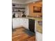 Bright kitchen features granite countertops, white cabinets, and stainless steel dishwasher at 8747 Mesquite Row, Lone Tree, CO 80124