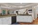 Bright kitchen area with granite countertops, white cabinets, and stainless steel dishwasher at 8747 Mesquite Row, Lone Tree, CO 80124