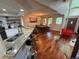 Open concept kitchen and dining area with breakfast bar, modern lighting, and seating at 8747 Mesquite Row, Lone Tree, CO 80124