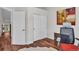 Home office space with modern desk, ergonomic chair, and artwork, perfect for productivity at 8747 Mesquite Row, Lone Tree, CO 80124