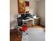 Bright home office featuring a modern desk setup and a comfortable ergonomic chair at 8747 Mesquite Row, Lone Tree, CO 80124
