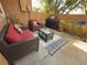 Cozy outdoor patio featuring comfortable seating, a modern coffee table, and a barbecue grill at 8747 Mesquite Row, Lone Tree, CO 80124