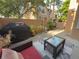 Outdoor patio space with a grill, seating, and privacy wall at 8747 Mesquite Row, Lone Tree, CO 80124