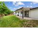 This home features a well-maintained backyard with a covered patio, and mature landscaping at 9197 W Woodard Dr, Lakewood, CO 80227